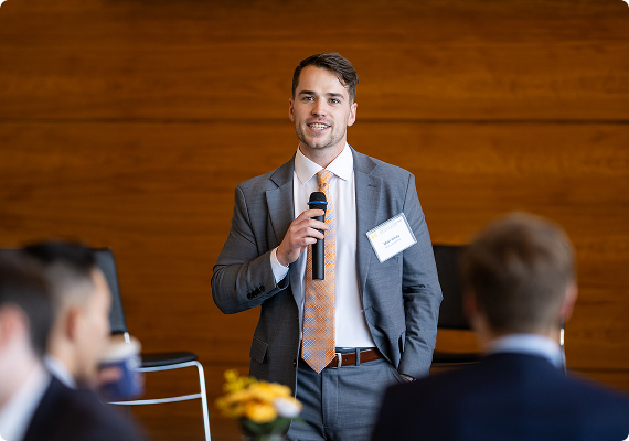 Student speaks in front of a crowd at Global Operations Conference 2025