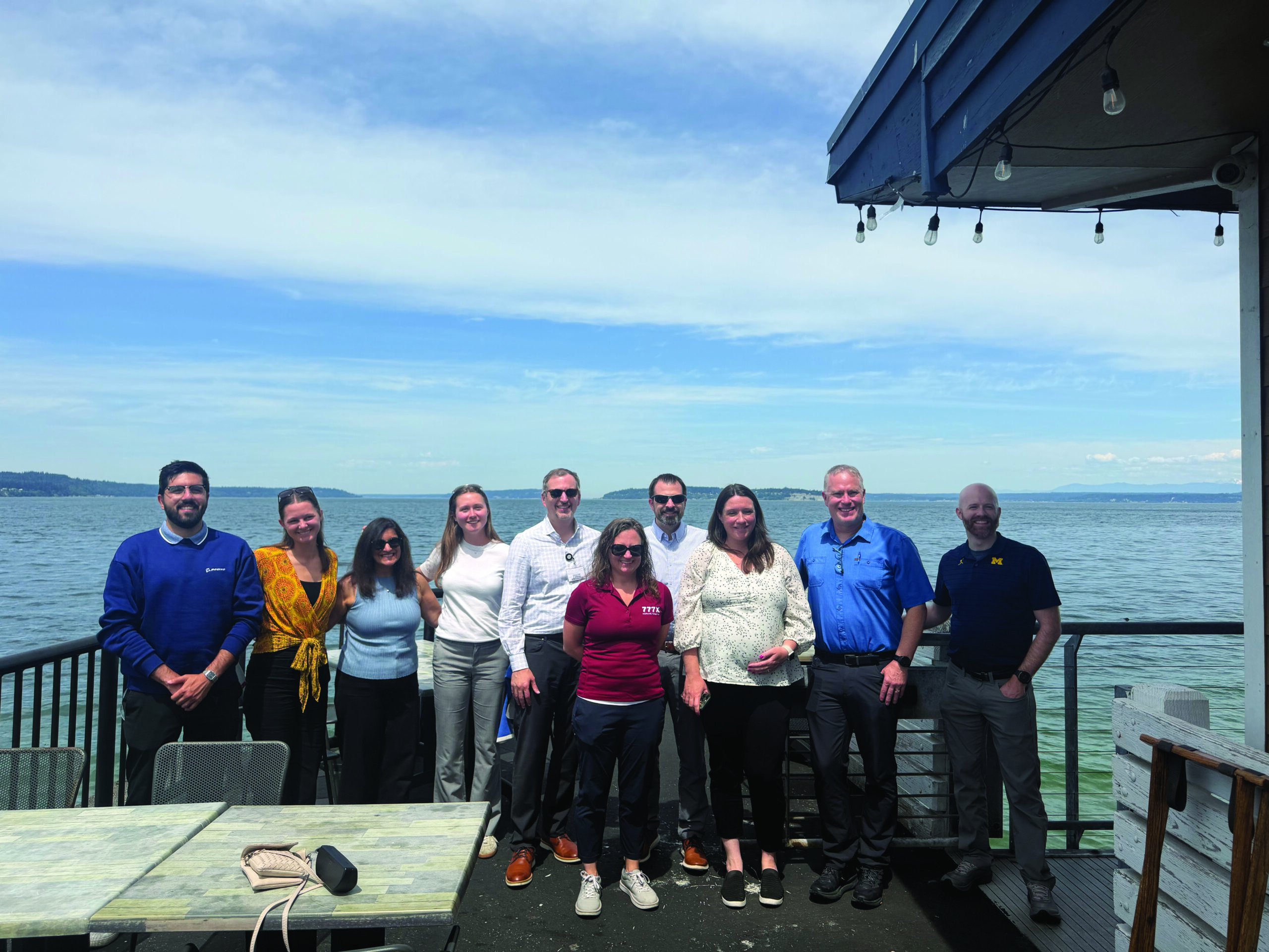 Boeing student team 2026, sponsors and Tauber leadership pose by the water