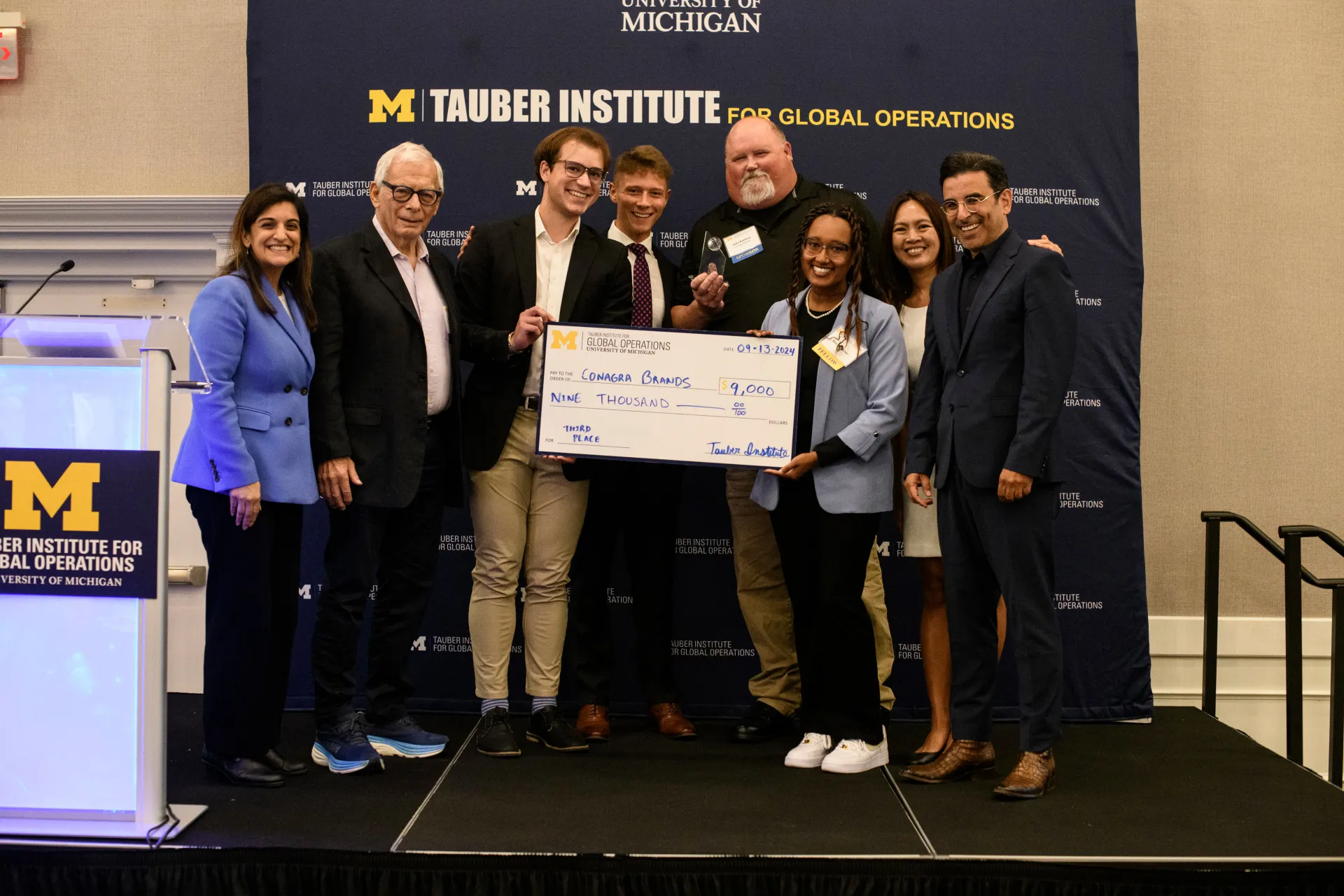 2024 Spotlight! third-place winners from Conagra Brands pose with their check